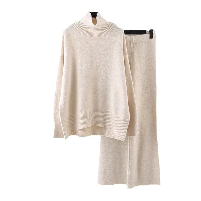 Women's beige acrylic knit sweater and wide-leg trousers two-piece set laid flat.