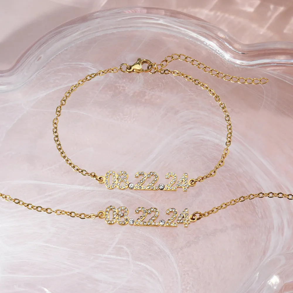 Stainless steel digital bracelet with diamond-studded numbers on the face, shown in a rose gold finish.