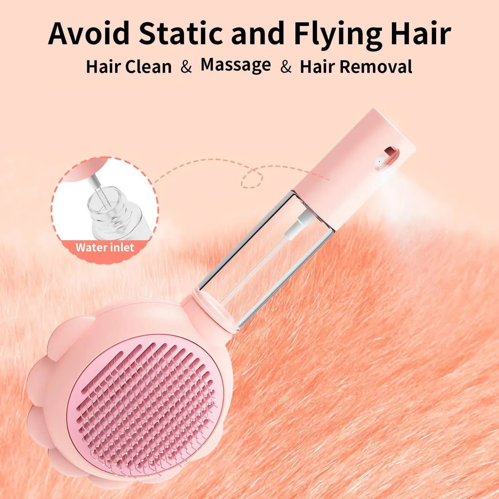 Grey spray cat brush with release button for grooming pets and removing loose hair.