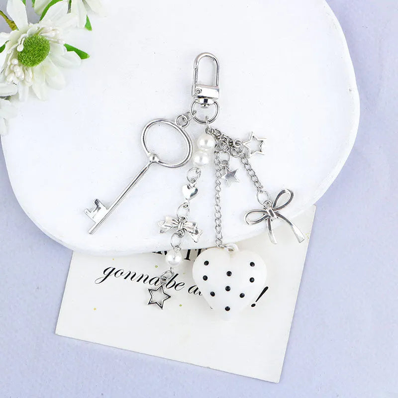 Retro zinc alloy key ring with bow and love heart chain design in multiple colour options