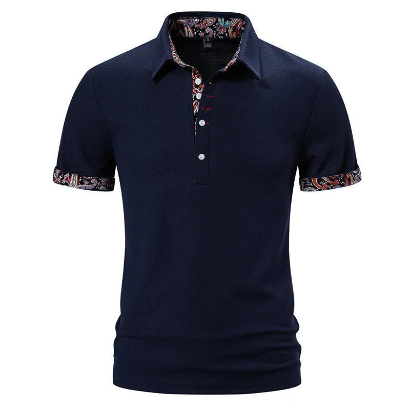Men's navy blue polo shirt with colour block stitching on the chest and short sleeves.