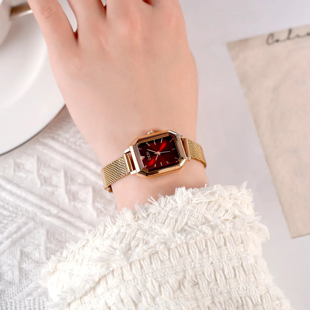 Women's square casual retro watch with rose gold shell and thin 8mm profile on wrist.