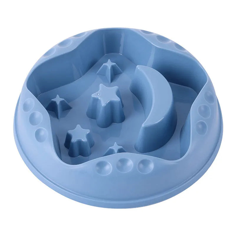 Blue slow feeder dog bowl with moon and star wing design and internal maze pattern.