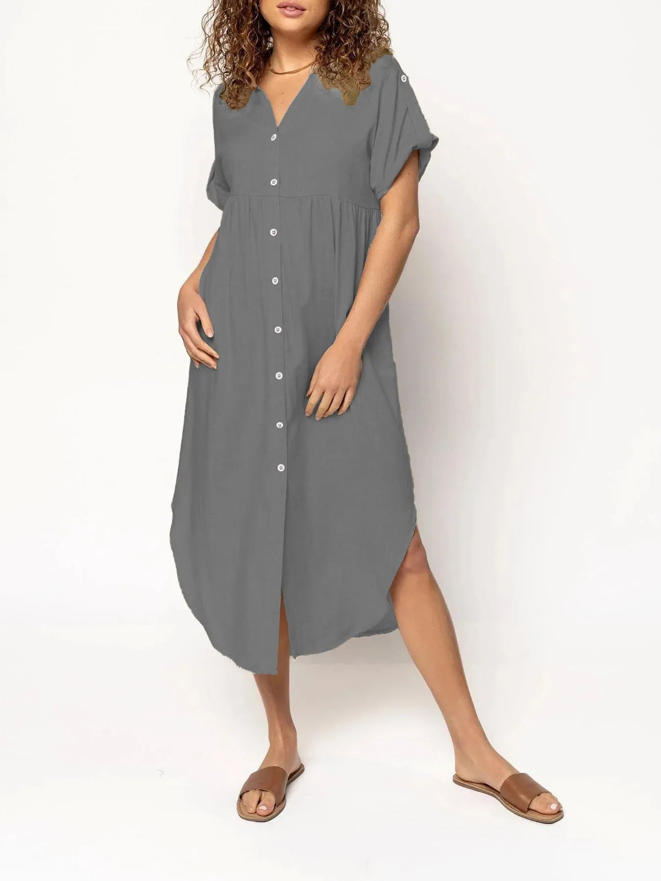 Women's loose fit casual dress with button front and mid-length skirt in solid colour.