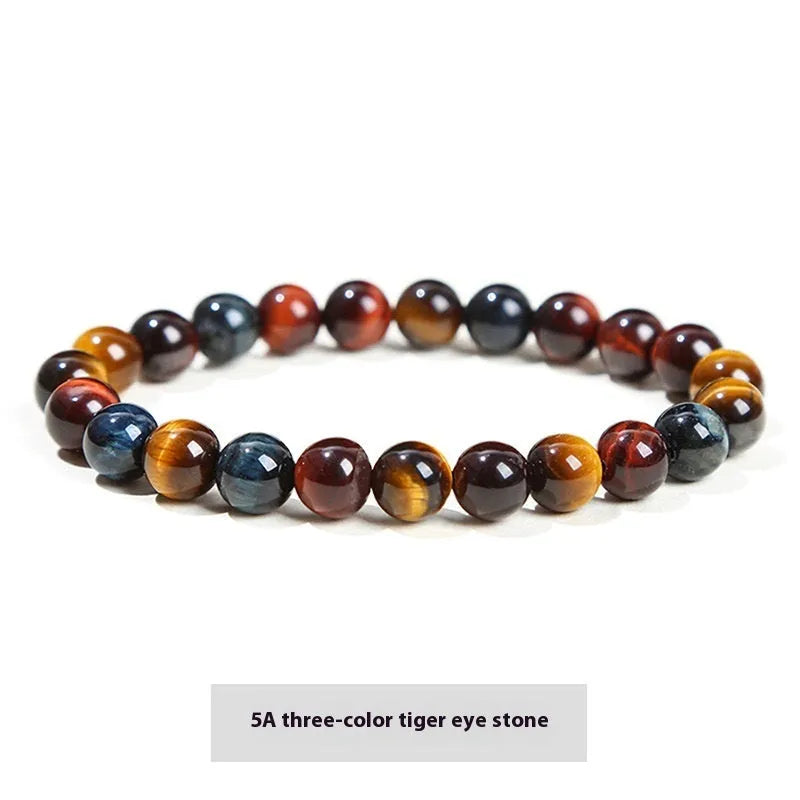 Natural tigereye crystal bracelet with yellow tiger eye beads approximately 8mm diameter on elastic cord