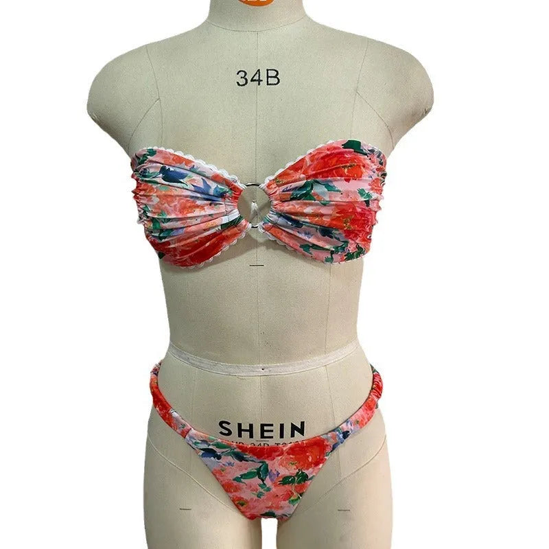 Floral printed lace bikini top in blue, shown as a sleeveless, backless tube top for swimming.