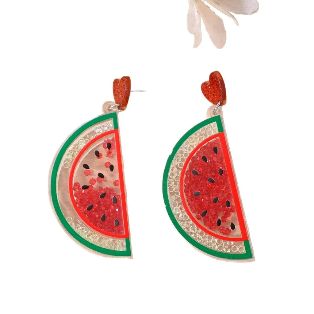 Colourful acrylic drop earrings with fruit and dessert charms including strawberry, cherry, pineapple, and watermelon.