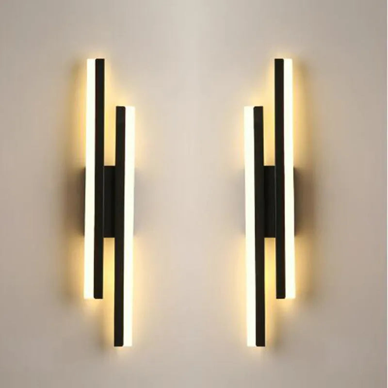 Minimalist Scandinavian-style LED wall light with acrylic shade in black or gold finish