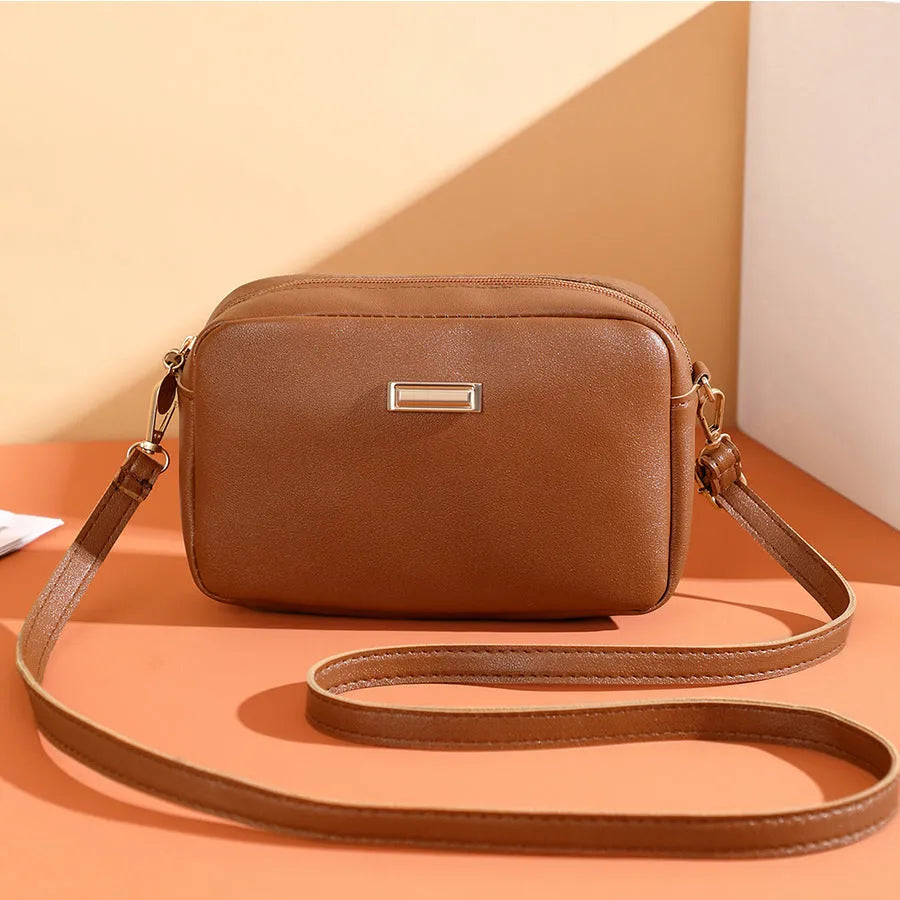 Solid colour minimalist ladies shoulder bag in PU leather with a three-dimensional pocket